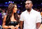 Kim Kardashian (L) and musician Kanye West watch the Los Angeles Lakers play the Denver Nuggets during Game 7 of their NBA Western Conference basketball playoff series in Los Angeles, California May 12, 2012.